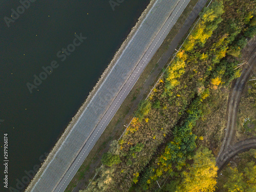 Aerial top down drone shot. Road near the lake.