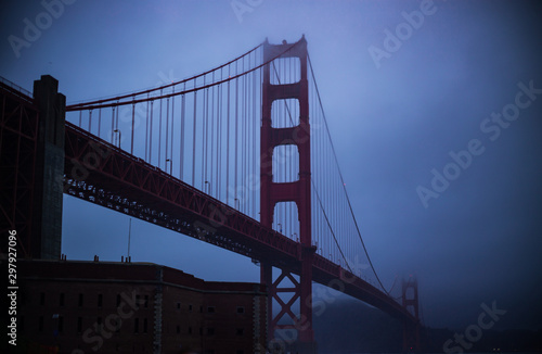 Fototapeta Naklejka Na Ścianę i Meble -  Golden Gate Bridge through a Misty Winter Night