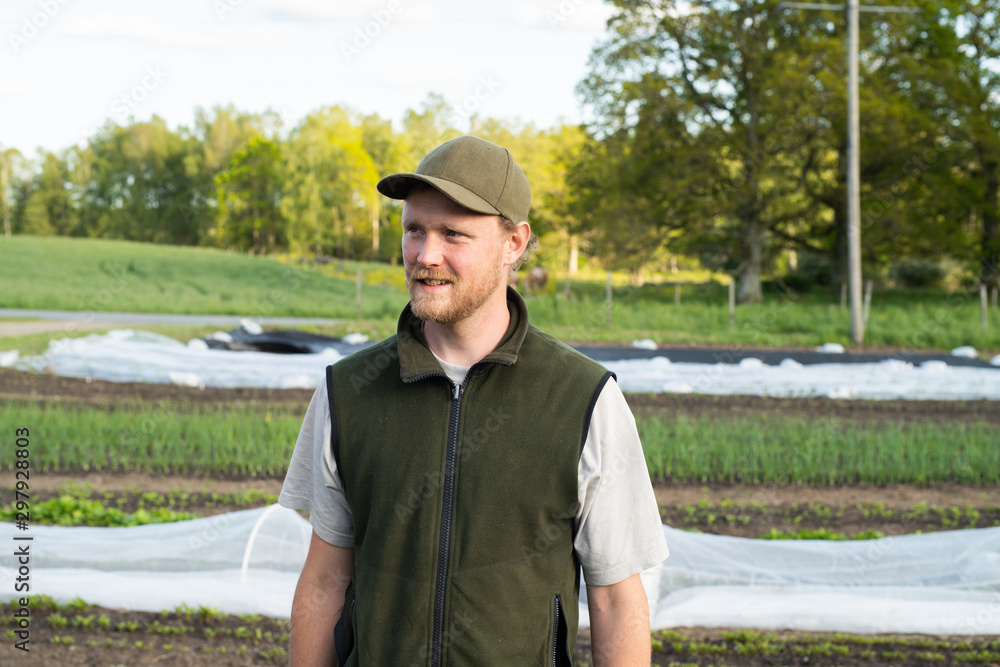 Portrait of a farmer standing in his garden Portrait of a farmer standing in his garden