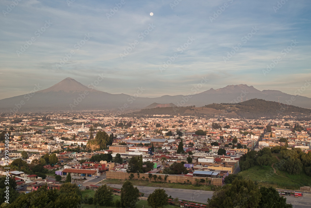 Panoramic view of the city, Popocatepetl volcano, San Gabriel Convent, the city is famous for its Great Pyramid, the largest archaeological site in the world at its base