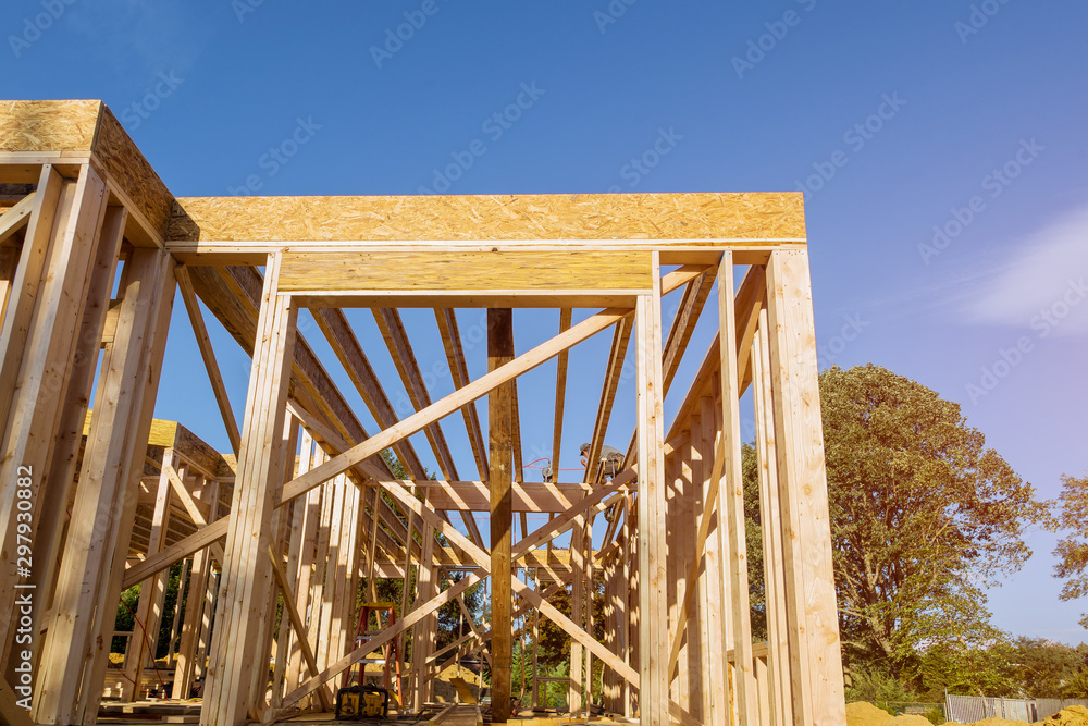 Obraz premium Building construction, wood framing new home under construction roof being built