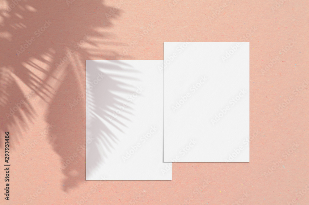 Blank white vertical paper sheet 5x7 inches with palm shadow overlay. Modern and stylish greeting card or wedding invitation mock up. Blank white vertical paper sheet 5x7 inches with palm shadow overlay. Modern and stylish greeting card or wedding invitation mock up.