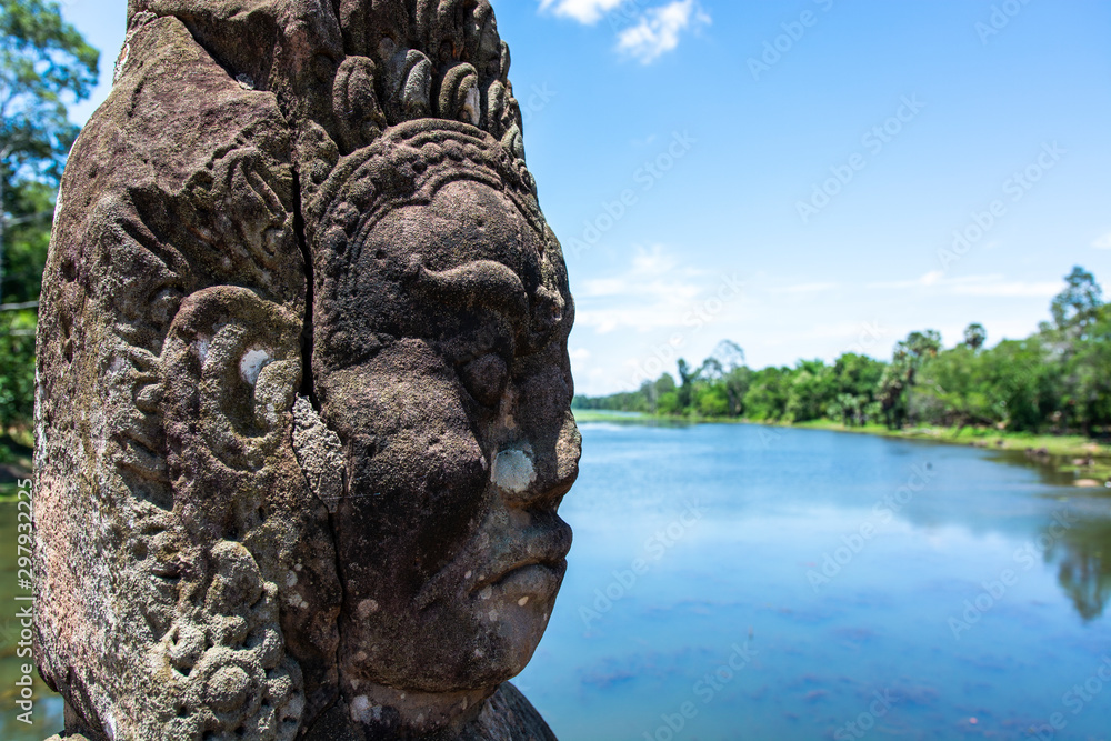 Angkor Thom, Cambodia, Stone face Asura over moat. Angkor Thom, Cambodia, Stone face Asura over moat.