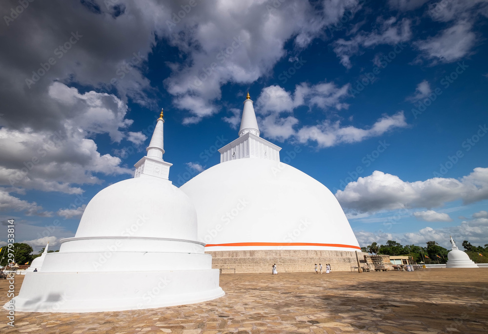 ANURADHAPURA/ SRI LANKA - AUGUST 07, 2019: Budhism at Ruwanweliseya are praying, Anuradhapura, Sri Lanka. .This place is one of the famous for the buddhism go to praying and meditating for buddha. ANURADHAPURA/ SRI LANKA - AUGUST 07, 2019: Budhism at Ruwanweliseya are praying, Anuradhapura, Sri Lanka. .This place is one of the famous for the buddhism go to praying and meditating for buddha.
