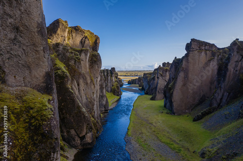 The most picturesque canyon Fjadrargljufur and the shallow creek, which flows along the bottom of the canyon. Fantastic country Iceland. September 2019. aerial drone shot