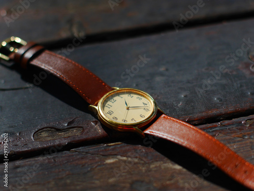 old wristwatchwatch on brown background