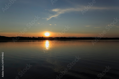 Sunset over a lake © Joe