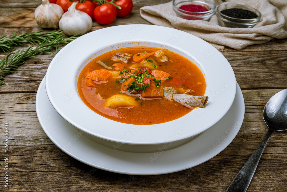 shurpa asian soup on wooden table shurpa asian soup on wooden table