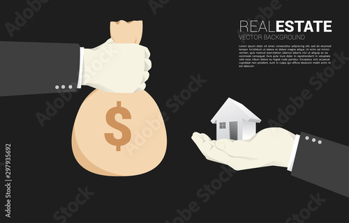Hand with money bag for hand with 3D home icon. Concept transaction in real estate business