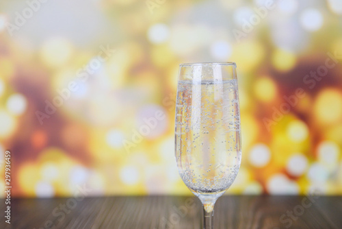 prosecco glass holiday drinks like themed party and holiday celebration concept with Champagne glasses for winter holidays decorated christmas lights bokeh gold