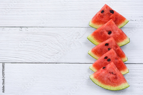 Fresh watermelon slice on white wooden background - watermelon tropical fruit on top view copy space
