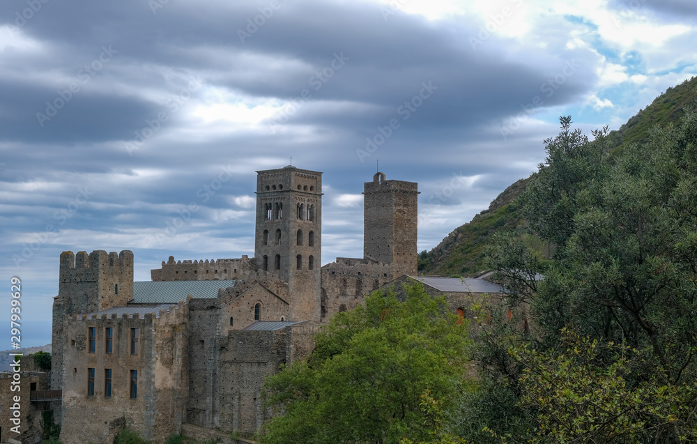 Monastery Sant Pere de Rodes, Catalonia, Spain. Antique mountain monastery. Hiking trails in the sights of Catalunya, Spain. Preservation and popularization of historical monuments. Monastery Sant Pere de Rodes, Catalonia, Spain. Antique mountain monastery. Hiking trails in the sights of Catalunya, Spain. Preservation and popularization of historical monuments.