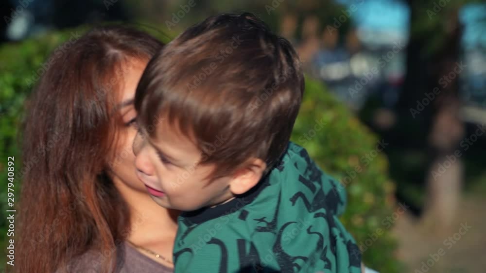 Two-year-old little son is naughty and crying on mom's hands Two-year-old little son is naughty and crying on mom's hands