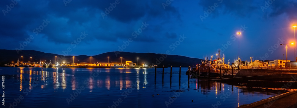 Lights, ships and boats in a Castletownbere harbor at night