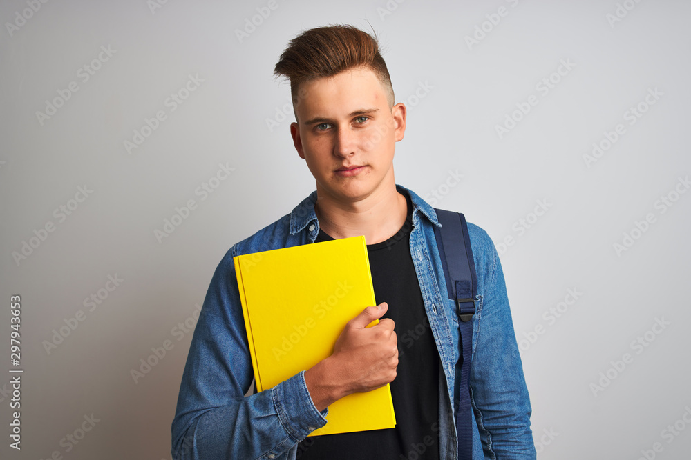 Young student man wearing denim shirt backpack notebook over isolated white background with a confident expression on smart face thinking serious Young student man wearing denim shirt backpack notebook over isolated white background with a confident expression on smart face thinking serious