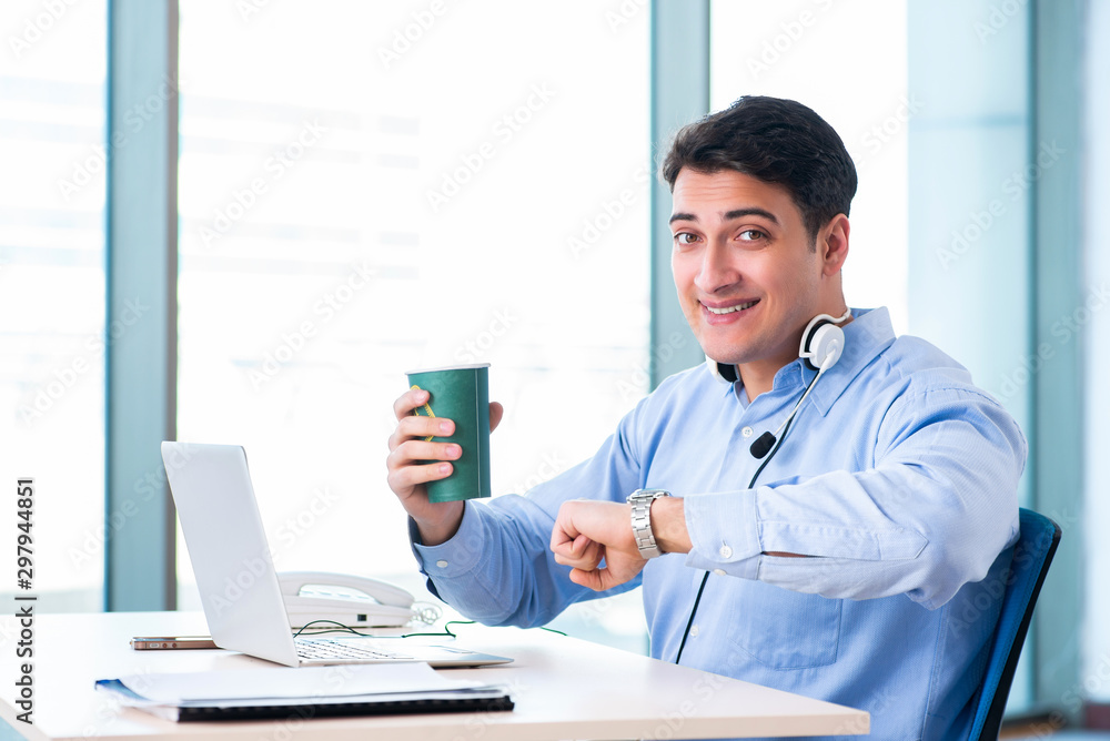 Male call-center operator in business concept Male call-center operator in business concept