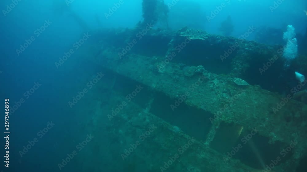 Wreck underwater in Truk Lagoon on Chuuk Islands. Shipwreck in historic place of terrible tragedy of WW II. Rust, metal corrosion and corals and diving among the wreckage of ship. Wreck underwater in Truk Lagoon on Chuuk Islands. Shipwreck in historic place of terrible tragedy of WW II. Rust, metal corrosion and corals and diving among the wreckage of ship.