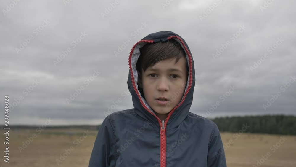 boy is surprised by an incredible unbelievable result outdoors in autumn boy is surprised by an incredible unbelievable result outdoors in autumn