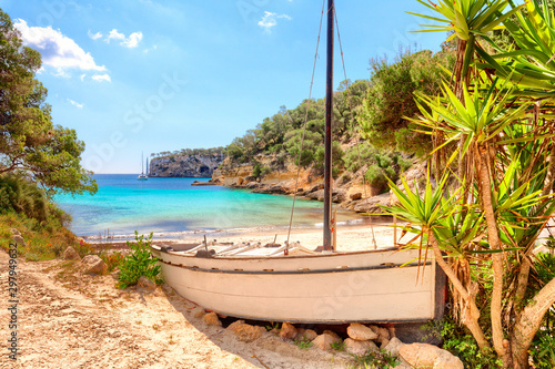 Cala Portals Vells Calvia Mallorca Majorca Spain old ship with palms and turquoise mediterranean sea photo