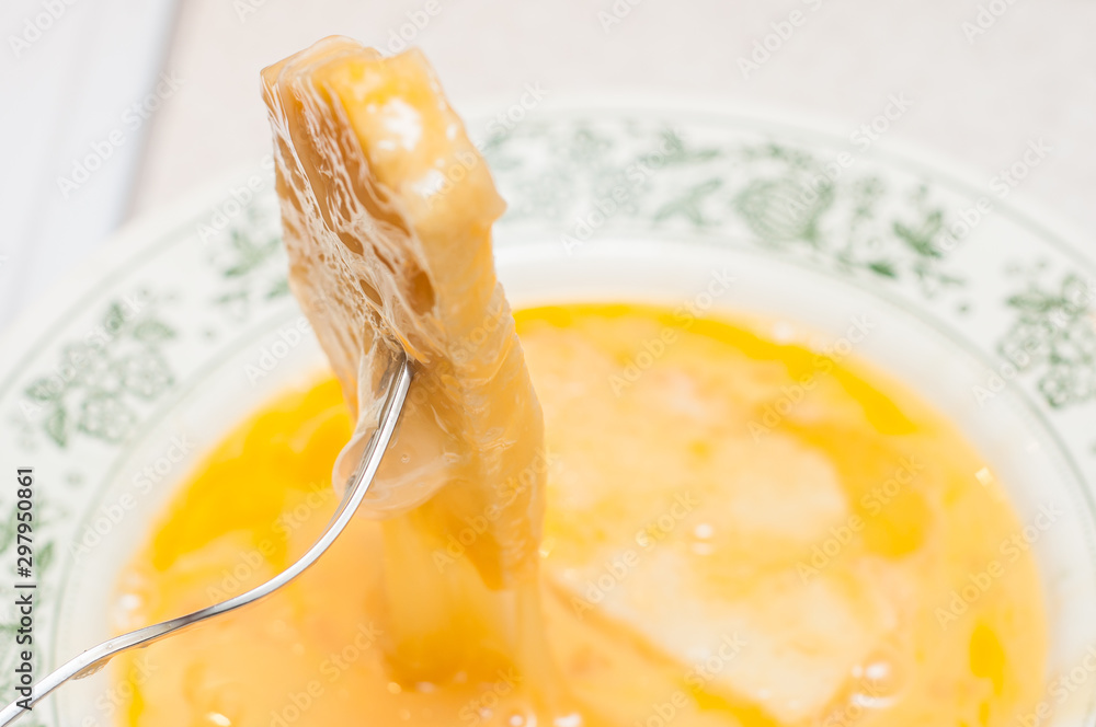 Soaking the cut bread in the egg mixture. Salvation of old bread from stale and flowering. Cooking croutons from bread and chicken eggs. Soaking the cut bread in the egg mixture. Salvation of old bread from stale and flowering. Cooking croutons from bread and chicken eggs.