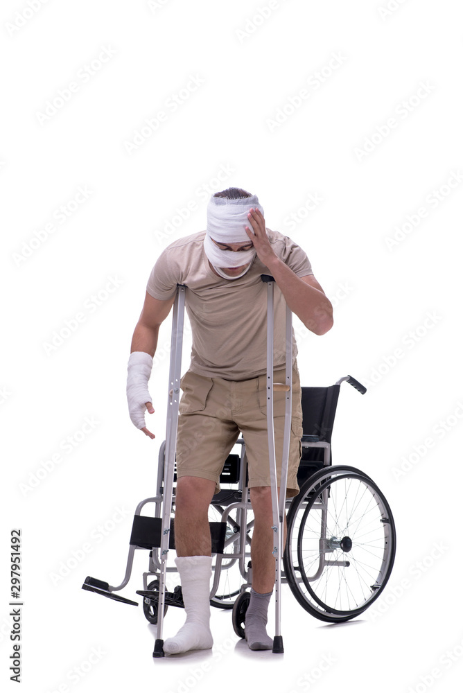 Naklejka premium Injured man in wheel-chair isolated on white