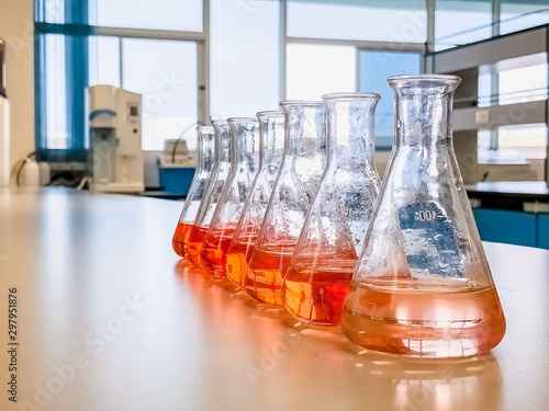The Erlenmeyer flask in the line with color range solvent using for analysis calibration curve of iron in waste water sample. The experiment in chemistry laboratory.
