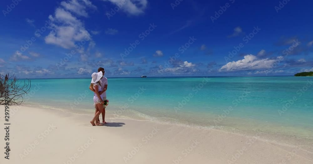 couple hugging in caribbean seashore couple hugging in caribbean seashore