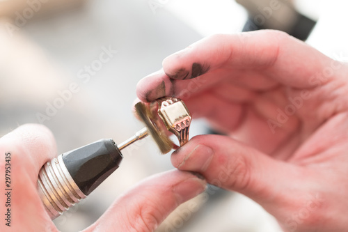 Close-Up Of Repairing Ring By Polishing Motors Tool