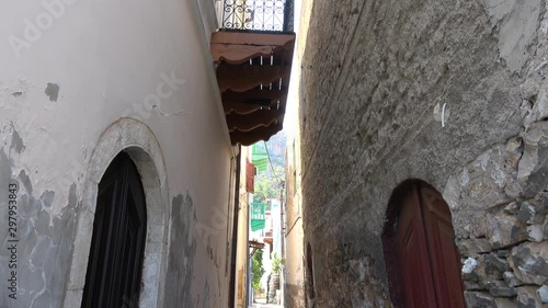 Castellorizo island, Greece - 1st of October 2019: 4K Tilt up Narrow streets of Meyisti town photo