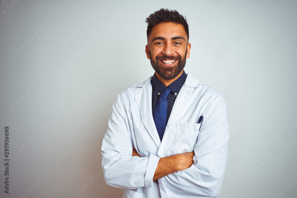 Young smiling doctor standing against white background Young smiling doctor standing against white background