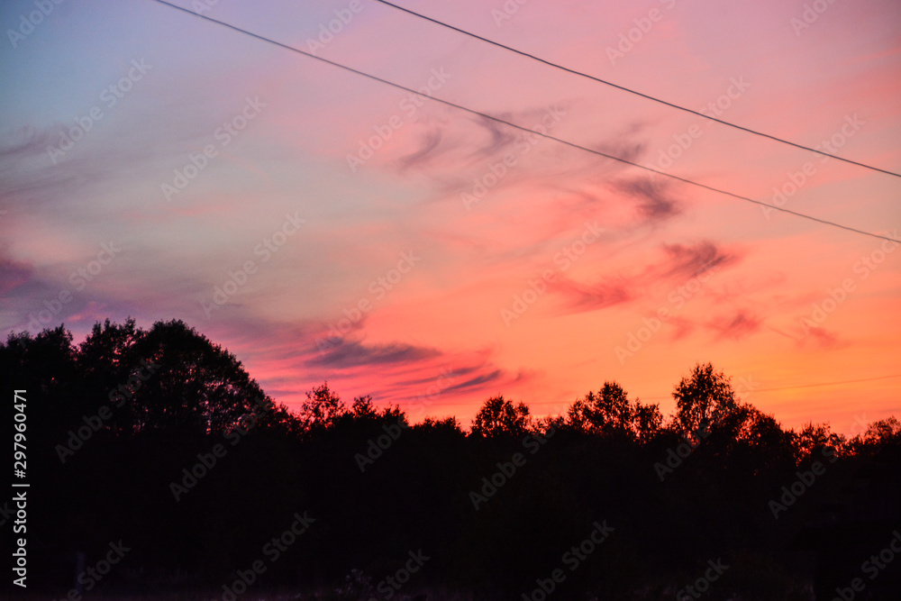 Beautiful colorful sunset summer evening in the village Beautiful colorful sunset summer evening in the village