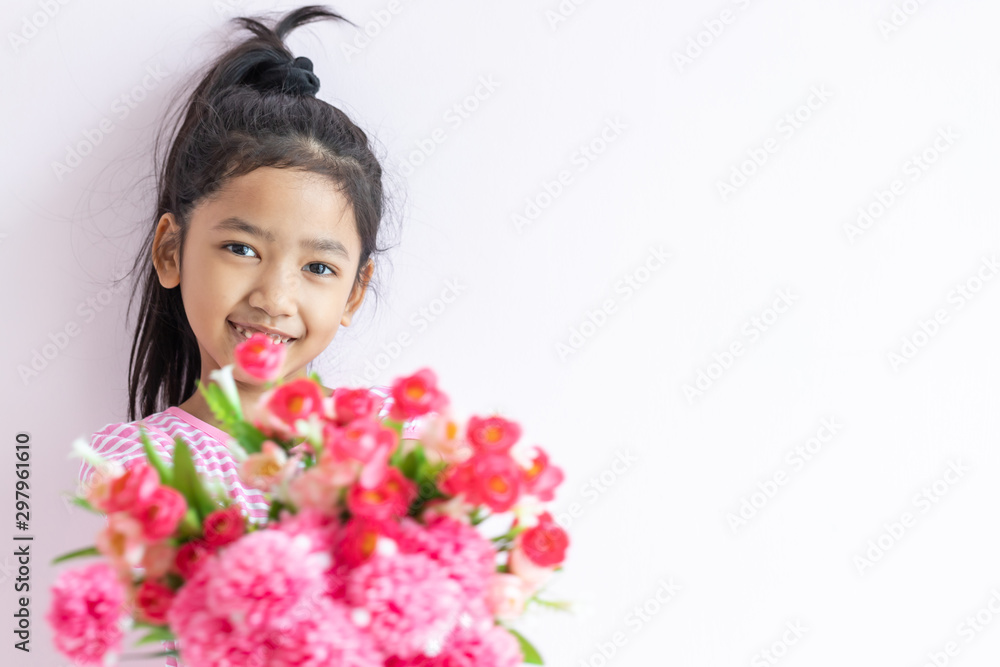 The child holding bouquet flowers with smiling and happy. The child holding bouquet flowers with smiling and happy.