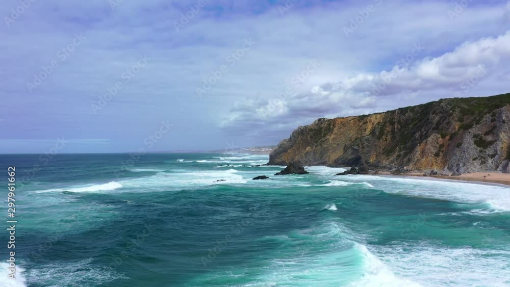 Amazing blue water of the Atlantic ocean at the Portuguese coast line - aerial drone footage Amazing blue water of the Atlantic ocean at the Portuguese coast line - aerial drone footage