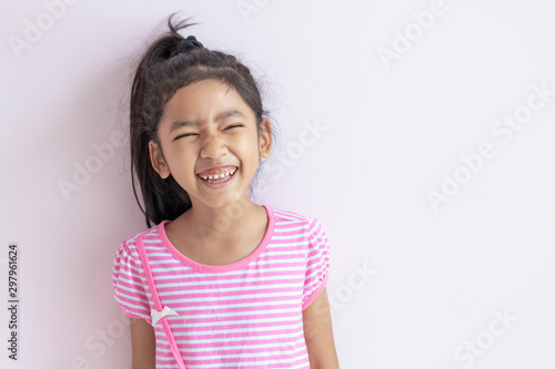 The child laughing and smiling with happiness.