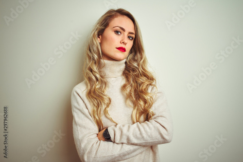 Quadro em tela Beautiful woman wearing winter turtleneck sweater over isolated white background
