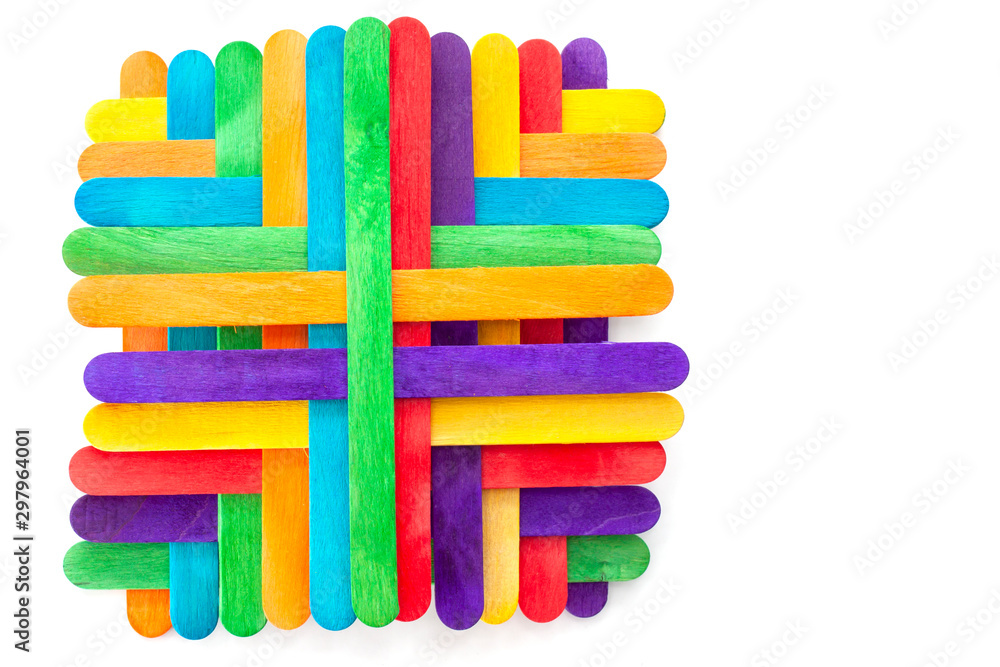 The arrangement of the colorful popsicle sticks isolated on white