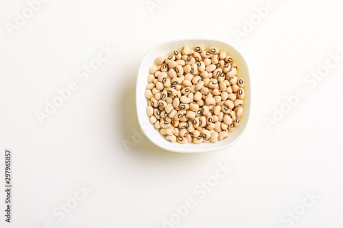 Black eyed seeds or chawali seeds in glass bowl on white background 