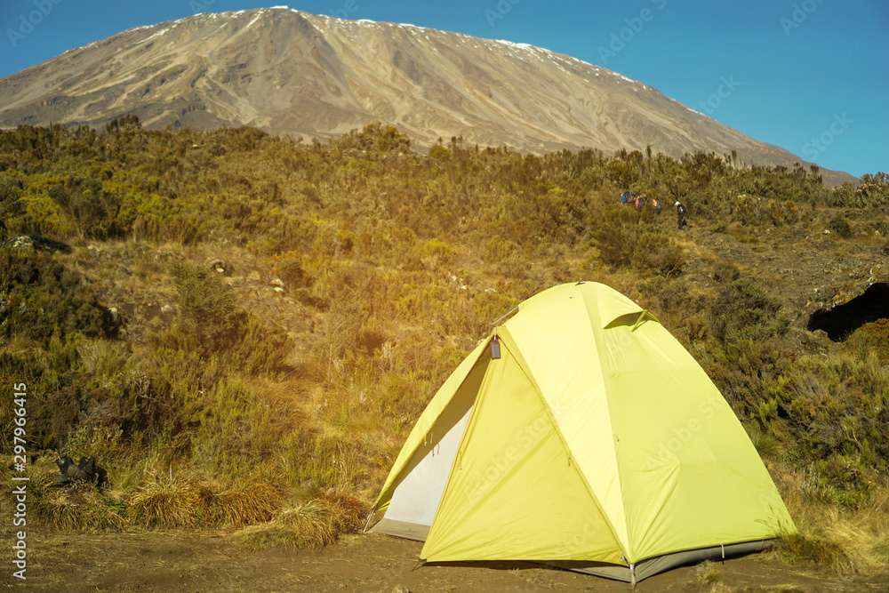 Camping spot on the mountain on the way up Kilimanjaro Mountain in Tanzania blue sky