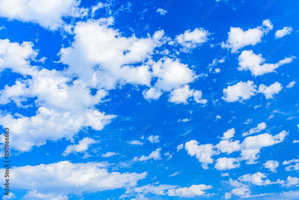 White fluffy clouds in the blue sky White fluffy clouds in the blue sky