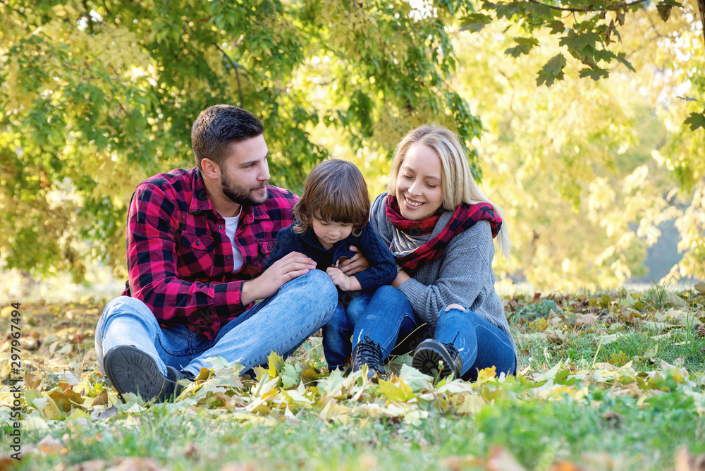 Fototapeta premium Young happy family spending time together outdoors