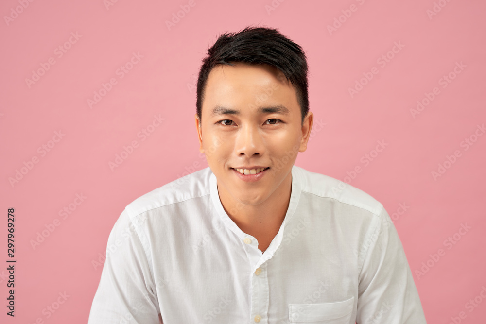 Young Asian man close up shot isolated on pink Young Asian man close up shot isolated on pink