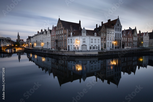 the mirrorrey in Bruges (Belgium)during the blue hour. One of the hotspots in Bruges for the tourists. Photo with a filter "big stopper" to make the clouds move.