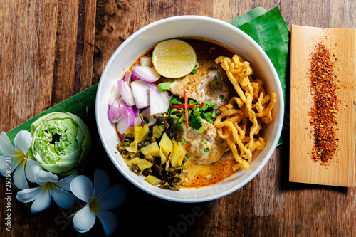 Khao Soi Chicken, a Thai food that is widely popular in the north along with the side dishes. photo