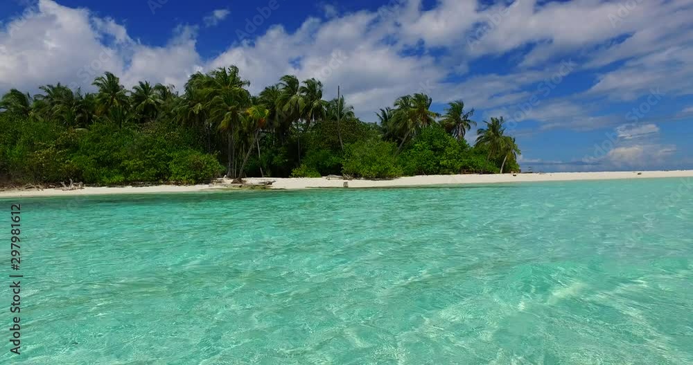 Crystal emerald water on lagoon surrounding tropical island with palms under a fabulous cloudy sky in Philippines Crystal emerald water on lagoon surrounding tropical island with palms under a fabulous cloudy sky in Philippines