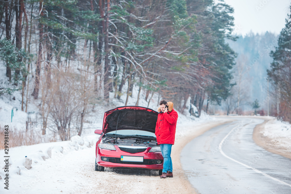 man standing near broken car with opened hood calling help man standing near broken car with opened hood calling help