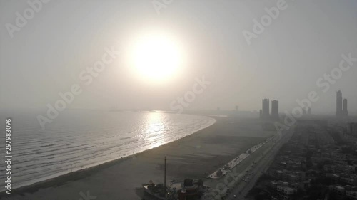 Front View Of Afternoon Sky With Sun In Karach Sea - Dolly Right To Left  photo