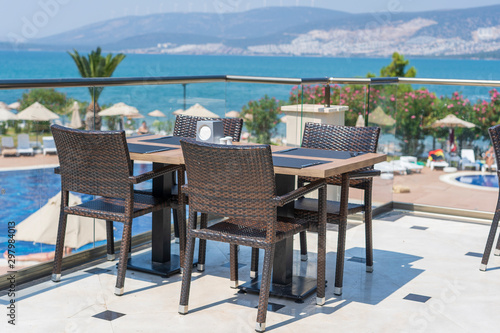 Table and chairs in restaurant   Turkey. Beach cafe near sea  outdoors. Travel and vacation concept