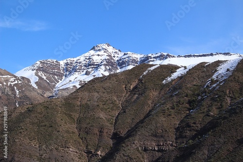 high snowy mountains in a valley of the Andes mountain range in Chile