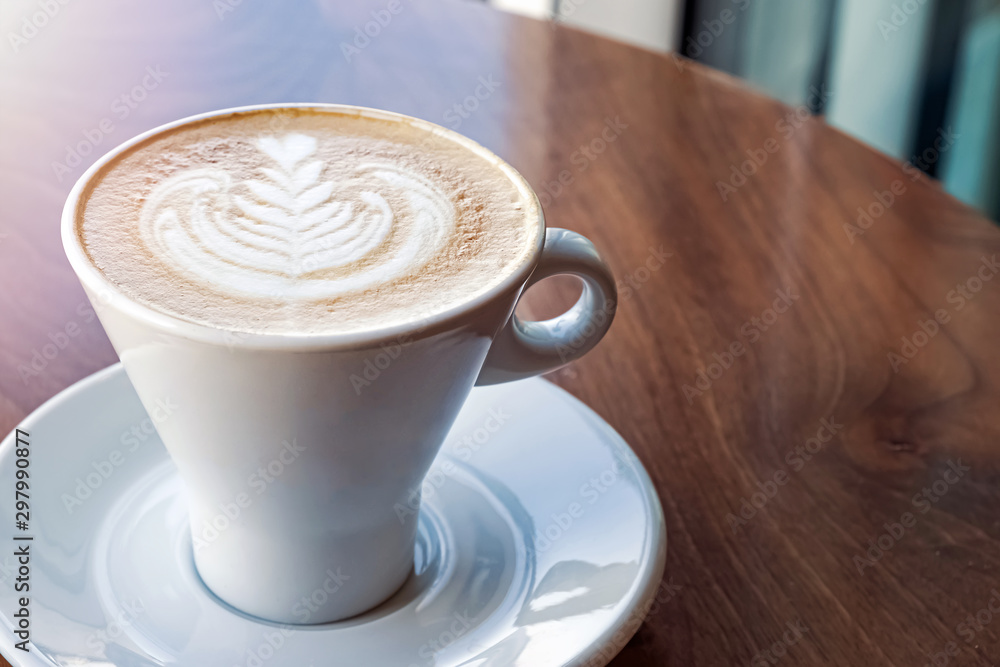 Fresh cappuchino or flat white coffee in a white cup with latte art Fresh cappuchino or flat white coffee in a white cup with latte art