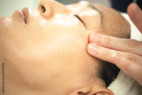 Closeup Asian woman doing treatment in beauty shop.